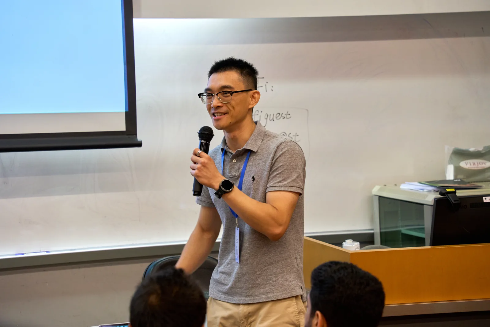 A tutorial speaker in discussion with participants