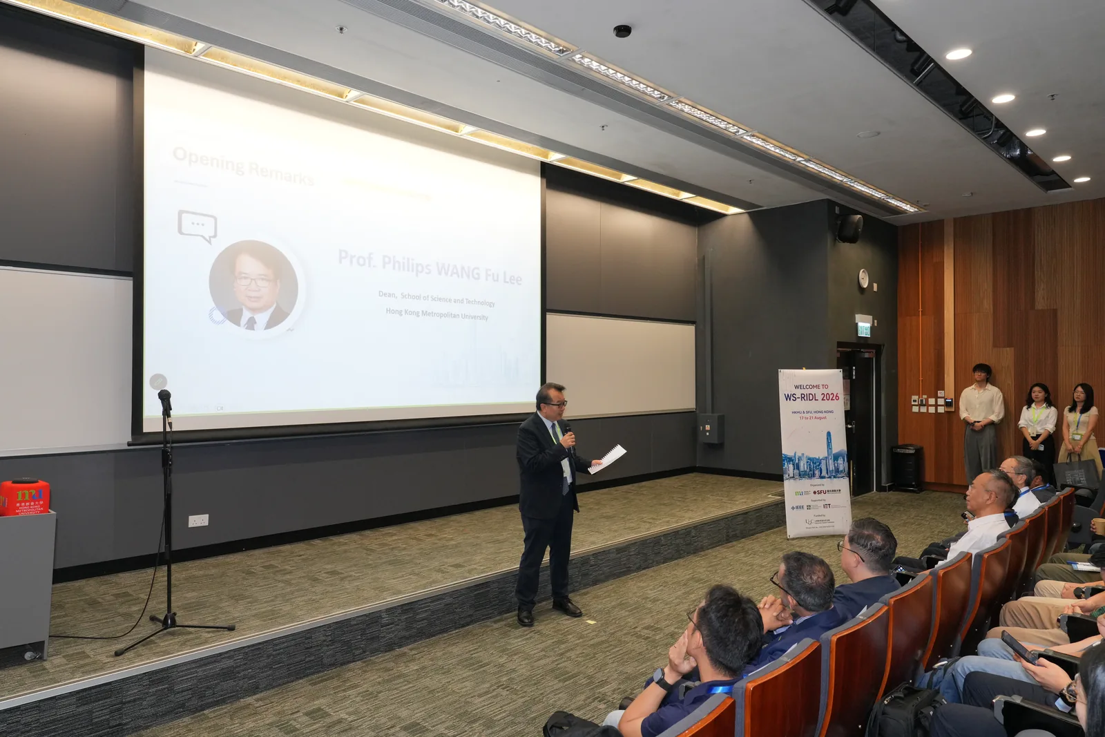 A speaker presenting to the workshop audience
