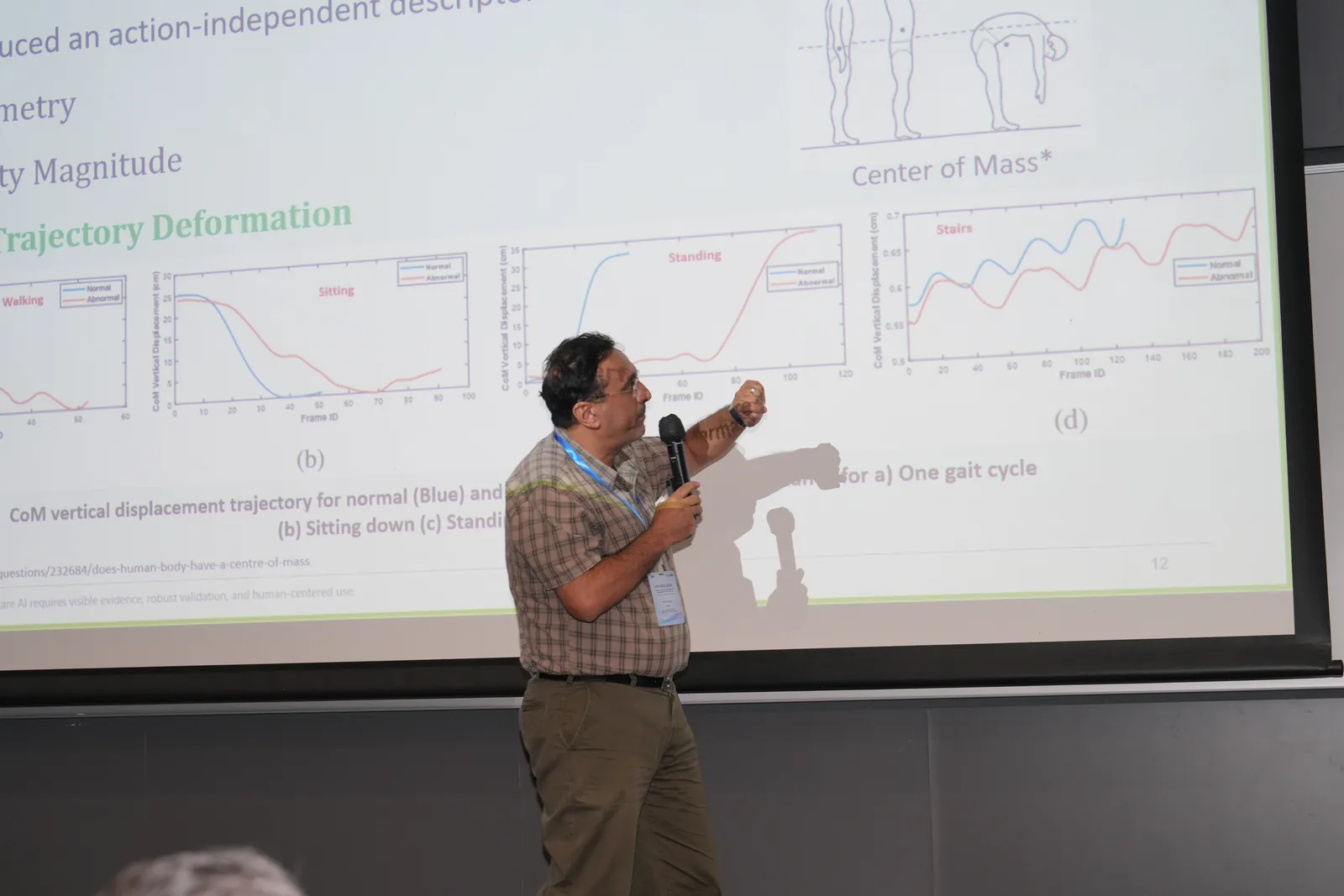 A speaker explaining a technical concept