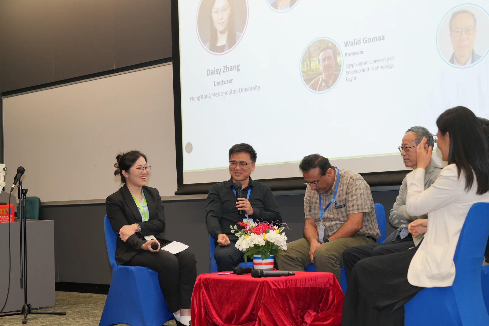 Panel members in conversation