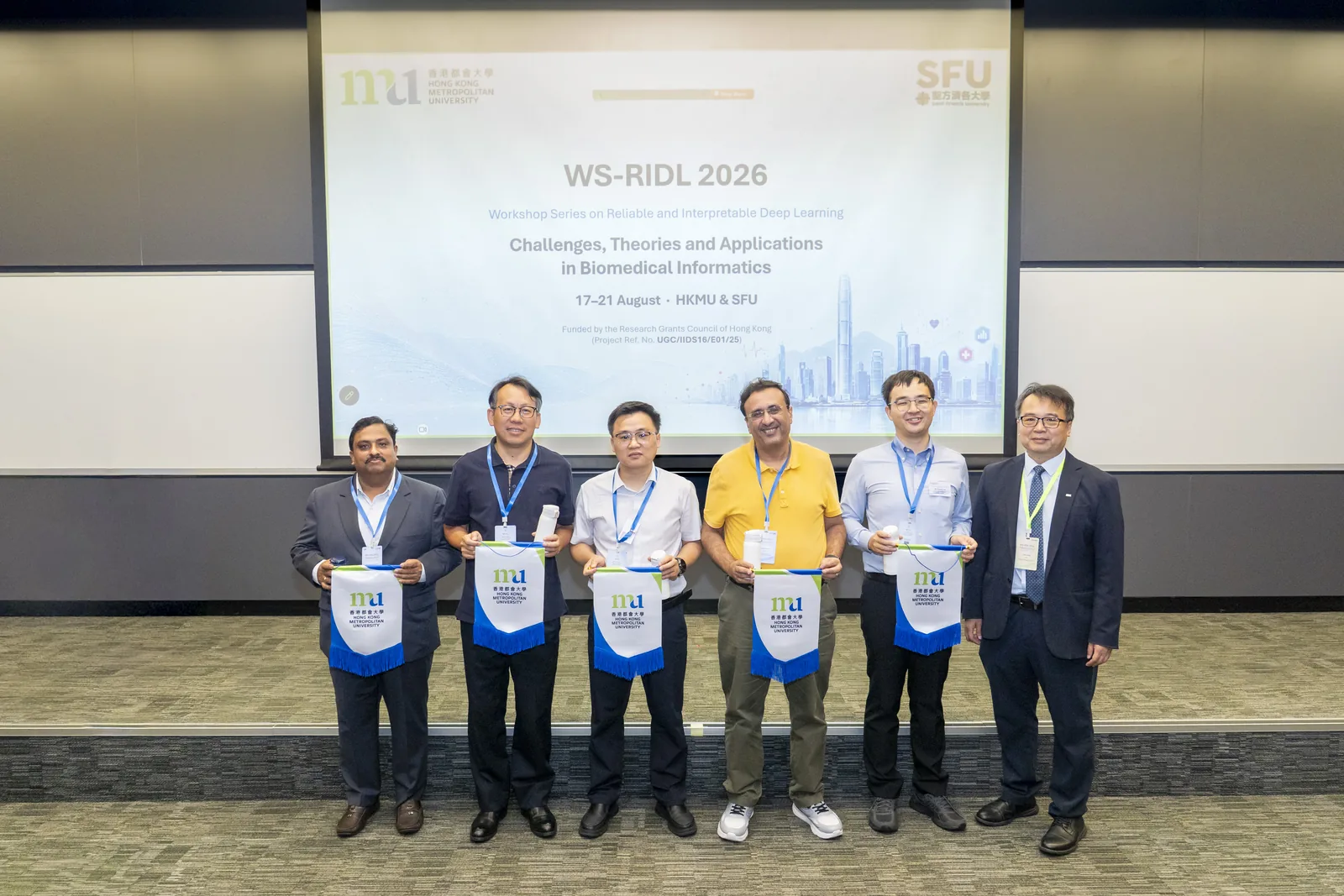 Workshop guests and organizers with commemorative gifts