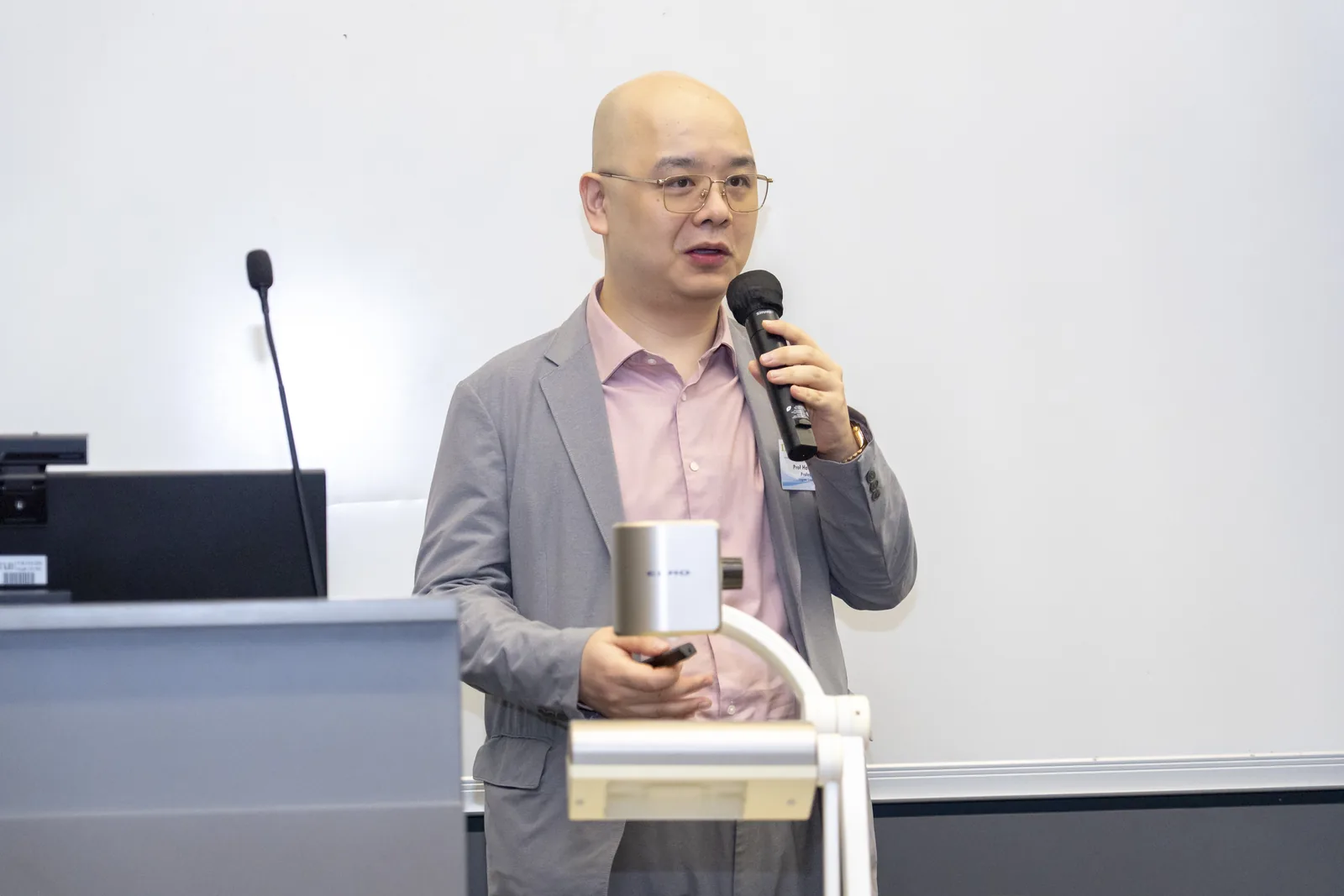 A speaker answering questions during a session