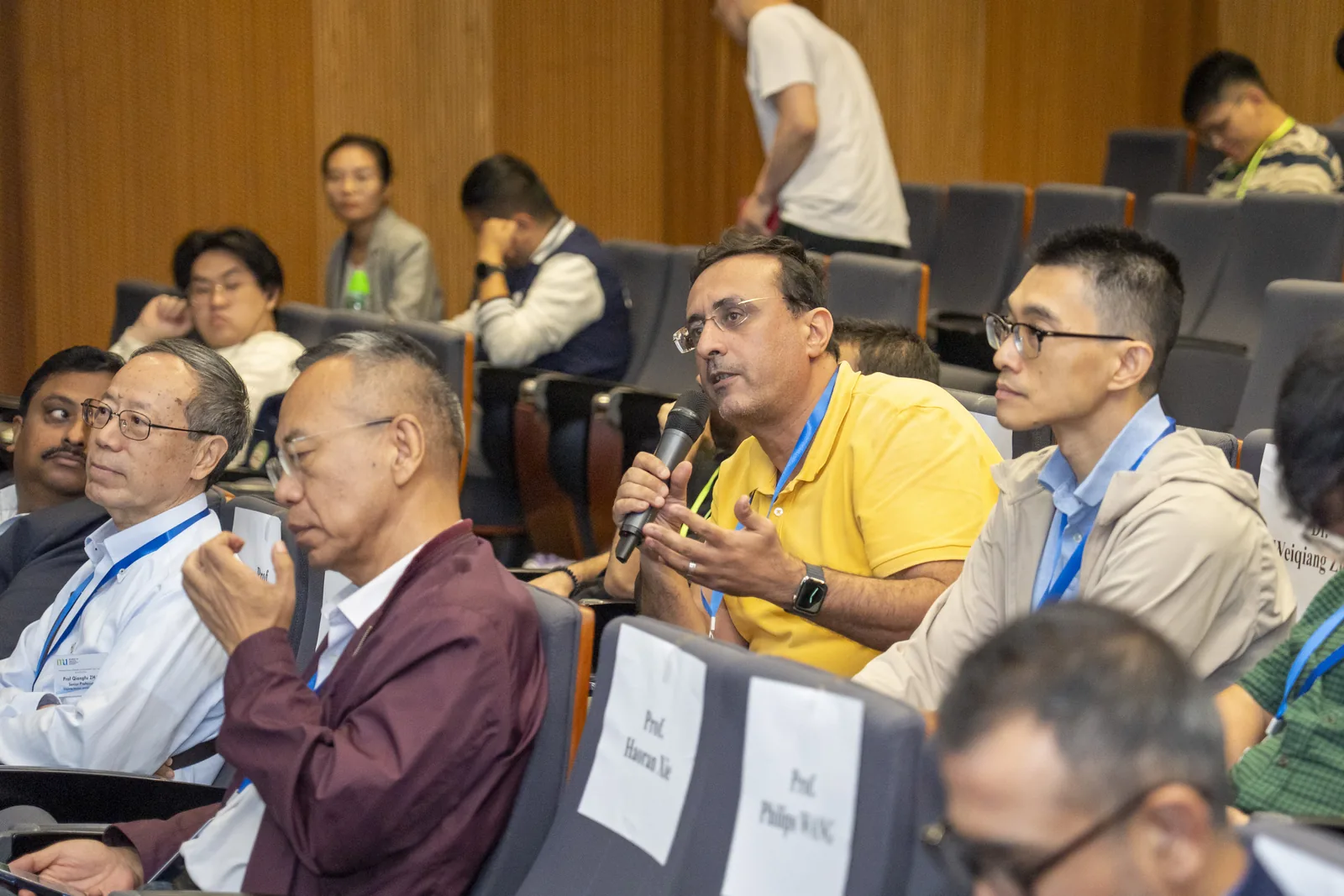 Audience members following a presentation